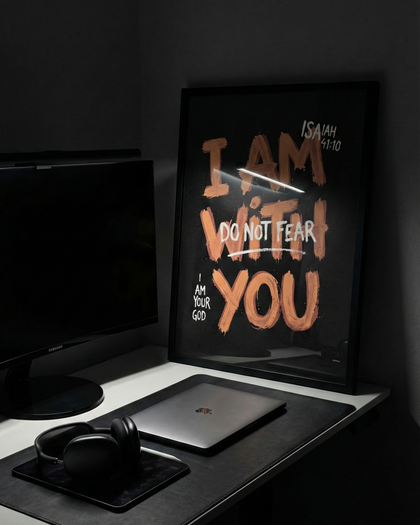 isaiah 41:10 dark poster standing on clean desk setup with flash bright light.